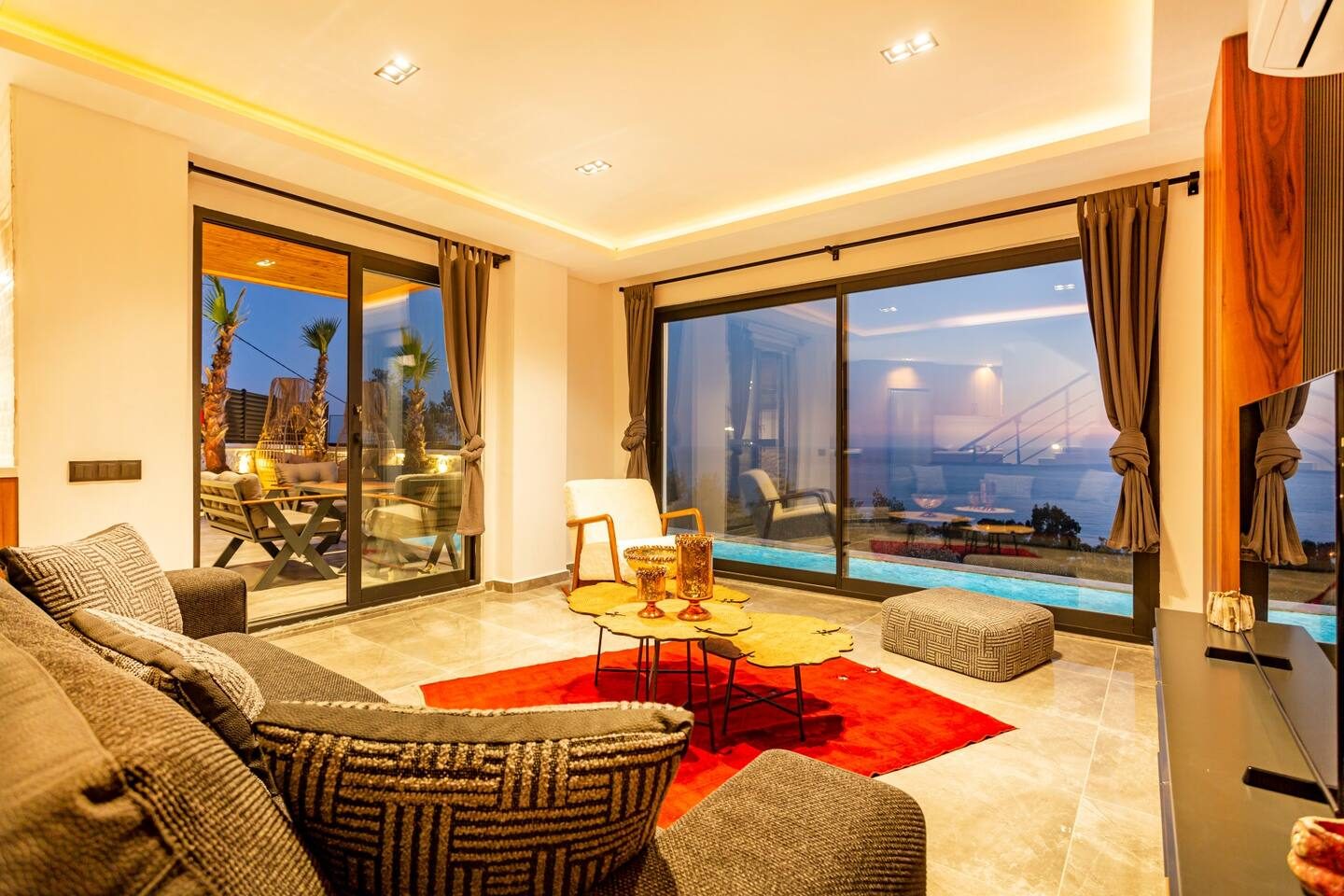 Living room opening onto the sea view terrace